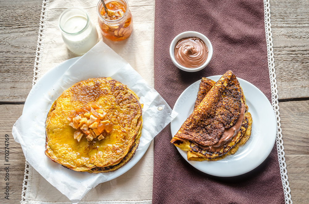 Poster pumpkin crepes with fruit confiture and chocolate cream