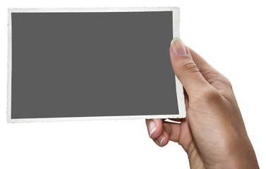 A woman holding an old black and white photo with clipping path for the inside