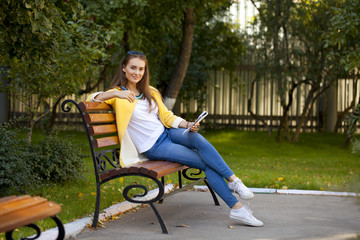 Beautiful young woman in yellow coat