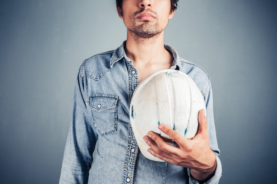 Proud worker with hard hat