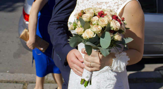 Bride holding wedding flower with blackberry bouquet