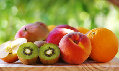 Orange, peach and sliced kiwis