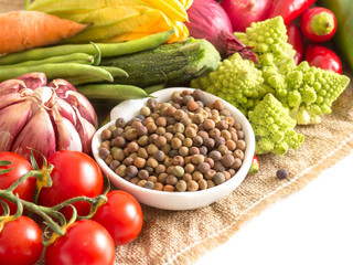 Raw organic roveja beans and vegetables