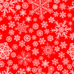 Christmas seamless pattern of snowflakes, white on red