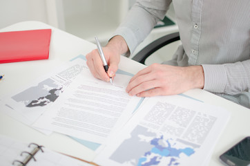 Businessman analyzing economic documents
