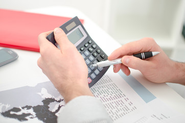 Businessman's hands with calculator