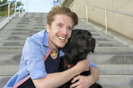 Happy young man with his dog