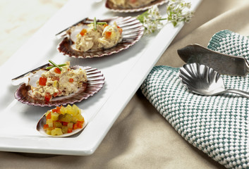 Tuna salad on scallop shells.