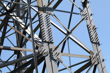 Steel framework against a clear blue sky
