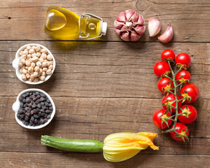 Vegetables and chickpea on a wooden table