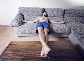 Man resting in sofa like jesus