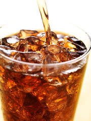 cola in glass cup with soft drink splash