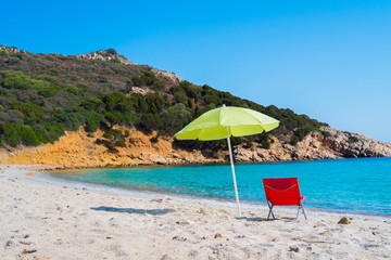 Beach umbrella and lounge chair