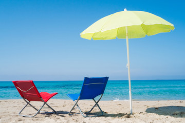 Beach umbrella and lounge chairs