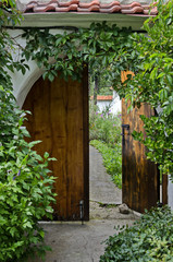 Door with flower for entrance in yard of monastery