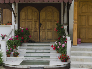 Fototapeta na wymiar Door with flower entrance of monastery