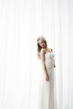 Young bride in wedding dress, studio shot .
