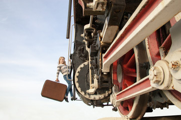 girls waiting for landing on the platform in  vintage train