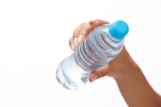 woman hand with bottle of water