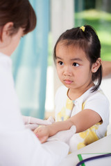 Fototapeta premium Scared asian girl before vaccine