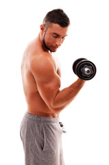 Fototapeta na wymiar Portrait of muscular man lifting dumbbell over white background