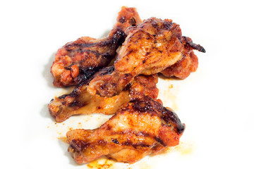 Grilled chicken wings isolated on white background