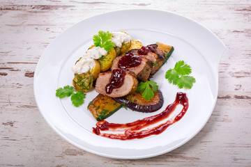 Roasted duck breast with cranberry sauce and vegetables