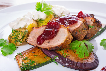 Roasted duck breast with cranberry sauce and vegetables