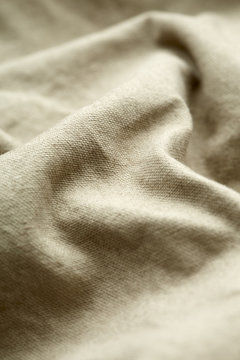 Close Up Of Beige Material On Clothing.