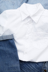 White shirt and denim jeans, close up.