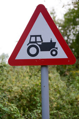 Obraz premium Tractor ahead sign and signpost