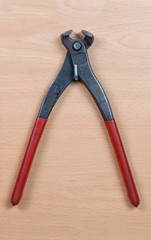 Tong on wooden background