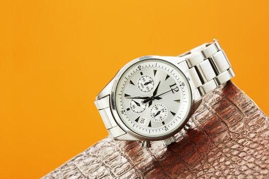 Luxury Men's Watch Against Colored Background .