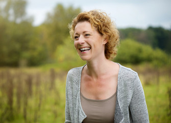 Smiling middle aged woman outdoors