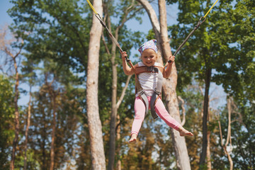 Little girl jumping on trampoline