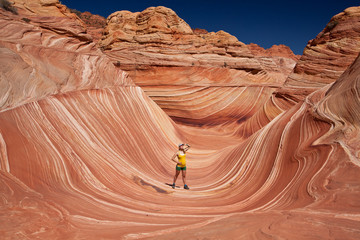 USA - girl in the Coyote buttes recreational park - The wave