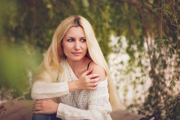 Obraz premium Dreamy young woman with blon hair