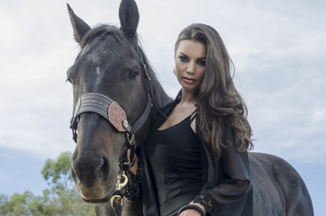 beautiful young woman and her horse