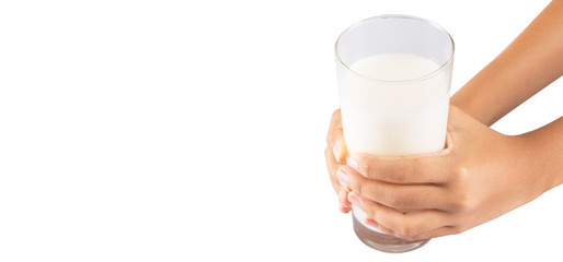 Young girl hand with a glass of milk
