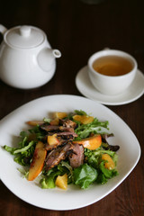 Salad with roasted duck breast and orange