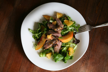 Salad with roasted duck breast and orange