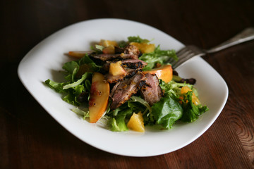 Salad with roasted duck breast and orange