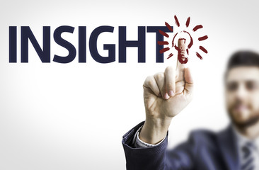 Business man pointing to transparent board with text: Insight
