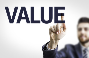 Business man pointing to transparent board with text: Value