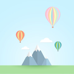 Fototapeta na wymiar Balloon in the sky and mountain landscape.