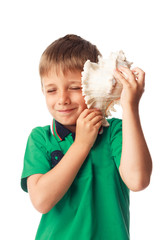 Little boy holding  a big shell isolated on white
