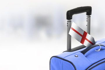 Destination England. Blue suitcase with flag.