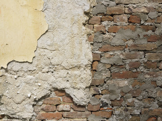 Fototapeta premium Old peeled brick wall divided into three sections