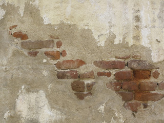 Old peeled brick wall