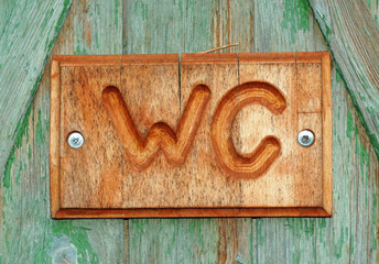 Wooden plaque with letters water closet